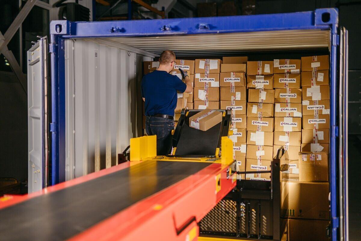 Operator loading parcels using ErgoRider platform